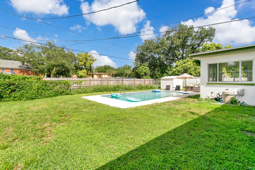 Private fenced backyard with pool